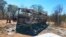 Emergency services stand near to a burned out bus after a bus accident in Gwanda about 550 kilometres south of the capital Harare, Nov. 16, 2018. Police in Zimbabwe say more than 40 people have been killed in a bus accident Thursday night.