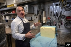 French baker Arnaud Delmontel talks about butter, its price and quality in his bakery in Paris, Dec. 16, 2024.