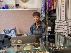 Goutte d'Or fashion designer Dyenaa Diaw has dressed superstar singer Beyonce — but she is staying put in the Paris neighborhood where she grew up. (Lisa Bryant/VOA)