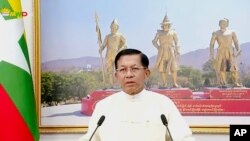 In this image from video broadcast April 18, 2021, over the Myawaddy TV channel, Senior General Min Aung Hlaing, chairman of the State Administrative Council, delivers his address to the public during Myanmar New Year. 