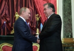 FILE - Russian President Vladimir Putin shakes hands with his Tajikistan's counterpart Emomali Rakhmon, right, at the Kremlin, Moscow.