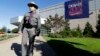 FILE – A New York state trooper stands outside the site of a debate between President Barack Obama and the Republican presidential nominee, former Massachusetts Gov. Mitt Romney, at Hofstra University's David S. Mack Sports Complex in Hempstead, New York.