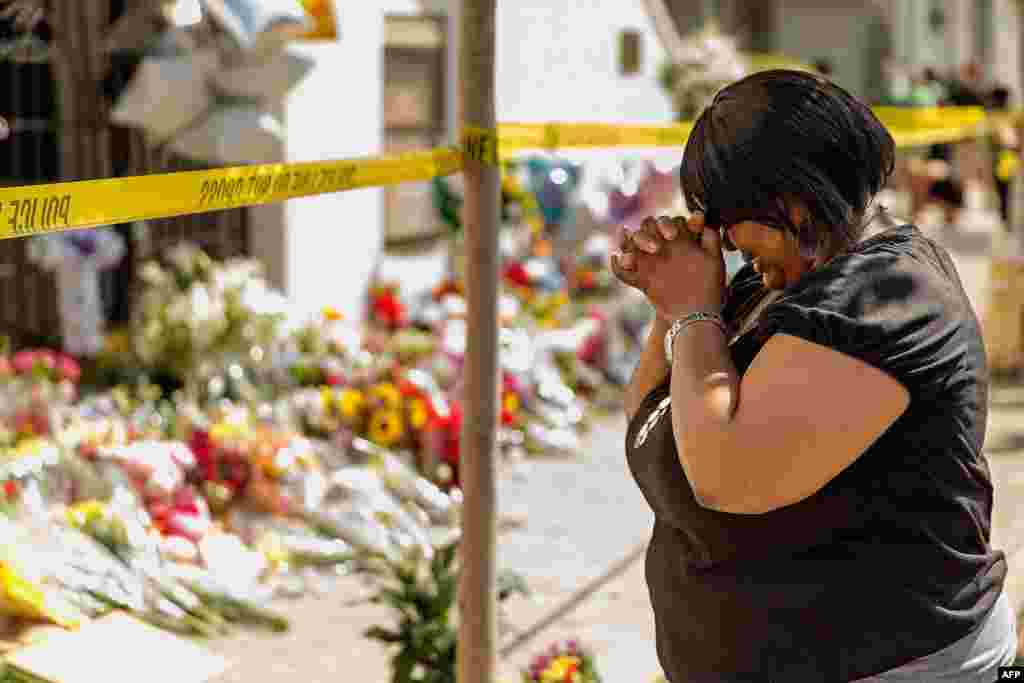 A woman weeps outside the historic Emanuel African Methodist Episcopal Church, Charleston, South Carolina. A mass shooting took the lives of nine people in the church on Wednesday.