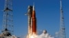 NASA's Artemis II mission to fly by the moon, comprising of the Space Launch System (SLS) rocket with the Orion crew capsule, lifts off