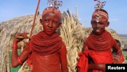 FILE - Bridesmaids from Kenya's smallest ethnic group, El-molo, prepare for a wedding ceremony in Loiyangalani, northeastern Kenya.