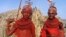 Bridesmaids from Kenya's smallest ethnic group El-molo prepare for a wedding ceremony in El-molo bay in Loiyangalani, northeastern Kenya, June 29, 2006. El-molo, who live on the southern shores of Lake Turkana are in very small numbers but the population 
