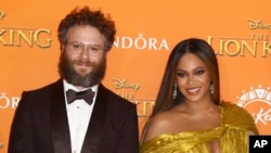 Seth Rogen and Singer Beyonce pose for photographers upon arrival at the 'Lion King' European premiere in central London, July 14, 2019. 
