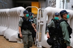 Riot police are seen during a march against new security laws, near China's Liaison Office, in Hong Kong, China, May 22, 2020.
