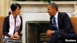 U.S. President Barack Obama speaks with Myanmar opposition leader Aung San Suu Kyi 