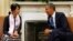 U.S. President Barack Obama speaks with Myanmar opposition leader Aung San Suu Kyi 