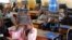Second-graders in Alieu Samb primary school hold up chalk boards with French conjugations. Dakar, Senegal, Dec. 7 2017. (Photo: Sofia Christensen for VOA) 