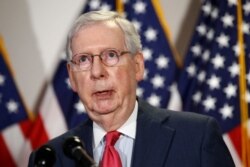 FILE - Senate Majority Leader Mitch McConnell of Kentucky speaks with reporters on Capitol Hill, May 19, 2020.