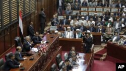 Yemeni President Ali Abdullah Saleh (3rd l) addresses the parliament in Sana'a, February 2, 2011