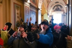 Supporters of President Donald Trump breach the U.S. Capitol building, Jan. 6, 2021.