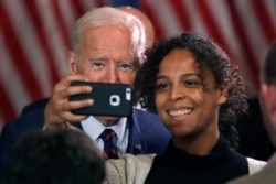 Democratic presidential candidate and former Vice President Joe Biden takes a selfie at a campaign event, Oct. 9, 2019, in Rochester, N.H.