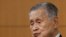 Yoshiro Mori, the president of the Tokyo Olympic organizing committee, listens to a question from a journalist during a news conference in Tokyo, Feb. 4, 2021.