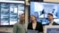 FILE – Facebook's Samidh Chakrabarti, director of elections and civic engagement, from left, stands with Katie Harbath, global politics and government outreach director, and Nathaniel Gleicher, head of cybersecurity policy, in the war room in Menlo Park, Calif., Oct. 17, 2018.