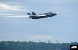 FILE - This Sept. 16, 2016 US Air Force handout photo shows a US Marine F-35 Lightning II taking off at Tyndall Air Force Base in Florida.