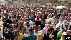 Supporters of ousted Egyptian President Mohamed Morsi cross the Nile as they march towards downtown Cairo from the Mohandeseen neighborhood of Cairo, Egypt, Aug. 16, 2013.