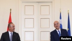 Greek Foreign Minister Nikos Dendias and his Turkish counterpart Mevlut Cavusoglu attend a news conference at the Ministry of Foreign Affairs in Athens, Greece, May 31, 2021.