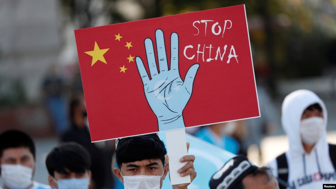 FILE - Ethnic Uighur demonstrators take part in a protest against China, in Istanbul, Turkey, Oct. 1, 2020. 