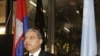 U.N. special rapporteur Surya Subedi walks through a Cambodian national flag upon his arrival in a conference room at the U.N. headquarter in Phnom Penh, (file photo). 