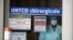A medical staff looks through a door in an hospital in Rennes, western France, April 1, 2020..