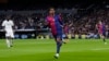 Barcelona's Lamine Yamal gestures after scoring his side's third goal during a Spanish La Liga match between Real Madrid and Barcelona at the Santiago Bernabeu stadium in Madrid, Spain, Oct. 26, 2024.