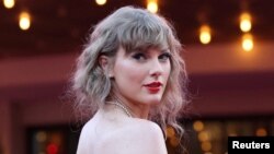FILE - Taylor Swift attends a premiere for Taylor Swift: The Eras Tour, in Los Angeles.