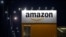 FILE - The logo of Amazon is seen at the company logistics center in Lauwin-Planque, France, Feb. 20, 2017. 