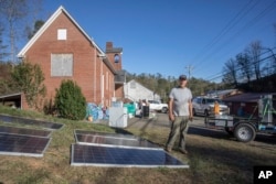 Bobby Renfro has spent thousands of dollars running generators to power a resource hub at the community building he established in Tipton Hill, NC, on Oct. 9, 2024.