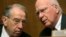 Chairman of the Senate Judiciary Committee, Senator Patrick Leahy (D-VT) (R) and Senator Chuck Grassley (R-IA) (L), confer before listening to NSA Director General Keith Alexander (not pictured) in Washington, Dec. 11, 2013.
