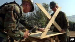 U.S Navy Mobile Construction Battalion 74 from Gulfport, Missisisippi made a table in Muzaffarabad, Pakistan, Monday, Oct 31, 2005. (AP Photo/ Achmad Ibrahim)