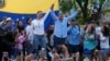 FILE - Venezuelan opposition leader Mariana Corina Machado, center-left, and then-presidential candidate Edmundo Gonzalez Urrutia, acknowledge supporters during a campaign rally in Guatire, Venezuela, May 31, 2024.
