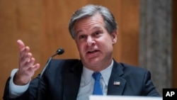 FBI Director Christopher Wray testifies during a Senate Homeland Security and Governmental Affairs Committee hearing on Capitol Hill in Washington, Sept. 24, 2020.