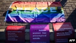 Banners and a rainbow flag are placed on the pavement outside the High Court in Gaborone, June 11, 2019. 