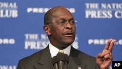 Republican presidential candidate Herman Cain answers questions at the National Press Club in Washington, October 31, 2011.