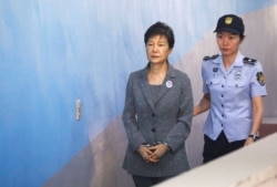 FILE - South Korean ousted leader Park Geun-hye arrives at a court in Seoul, South Korea, Aug. 25, 2017.