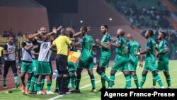 Comoros' players celebrate after scoring their third goal during the Group C Africa Cup of Nations (CAN) 2021 football match between Ghana and Comoros at Stade Roumde Adjia in Garoua on Jan. 18, 2022.