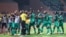 Comoros' players celebrate after scoring their third goal during the Group C Africa Cup of Nations (CAN) 2021 football match between Ghana and Comoros at Stade Roumde Adjia in Garoua on Jan. 18, 2022.