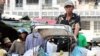 A cyclo driver ferries goods to Psar Kandal market in Phnom Penh.