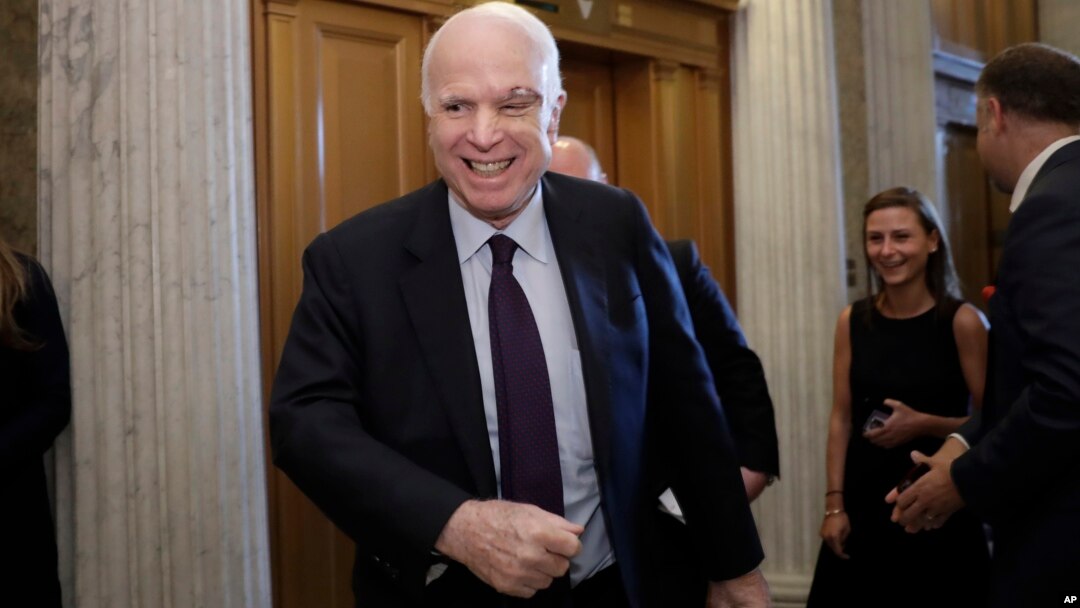 Sen. John McCain, R-Ariz., smiles as he arrives to vote as the Republican-run Senate rejected a GOP proposal to scuttle President Barack Obama's health care law, July 26, 2017, in Washington.