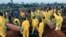 Volunteers handle a coffin during a mass funeral for victims of heavy flooding and mudslides in Regent at a cemetery in Freetown, Sierra Leone, Aug. 17, 2017. 