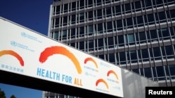 A banner is displayed at the headquarters of the World Health Organization (WHO) during the World Health Assembly following the outbreak of the coronavirus disease (COVID-19) in Geneva, Switzerland, May 18, 2020. 