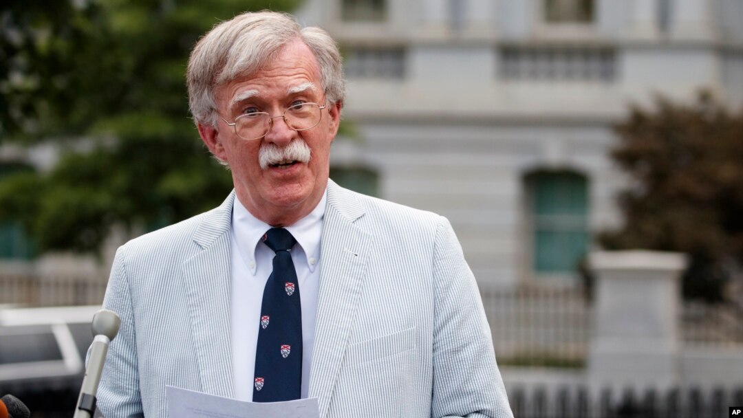 FILE - National security adviser John Bolton speaks to media at the White House in Washington, July 31, 2019. 