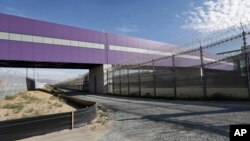 FILE - The pedestrian bridge is shown at the Cross Border Xpress air terminal in San Diego, California, Nov. 25, 2015.