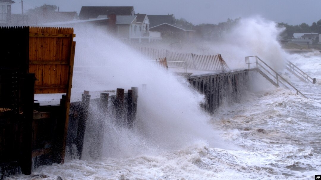 Waves pound a seawall in Montauk, N.Y., Aug. 22, 2021, as Tropical Storm Henri affects the Atlantic coast.