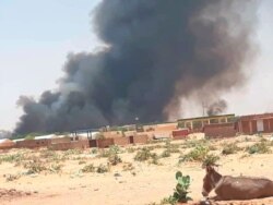 This photo provided by Organization for the General Coordination of Camps for Displaced and Refugees, smoke rises from Abu Zar camp for displaced persons in West Darfur, Sudan, Apr. 6, 2021.