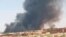 This photo provided by Organization for the General Coordination of Camps for Displaced and Refugees, smoke rises from Abu Zar camp for displaced persons in West Darfur, Sudan, April 6, 2021. 