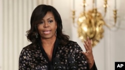 Michelle Obama Racist Post: FILE - In this Friday, Oct. 21, 2016, file photo, first lady Michelle Obama speaks to student participants during a Grammy Museum musical workshops hosted by the first lady in the East Room of the White House in Washington. Clay Town, W.Va. Mayor Beverly Whaling resigned her post Tuesday, Nov. 15, following a backlash after she posted a response to a racist comment about the first lady on Facebook.